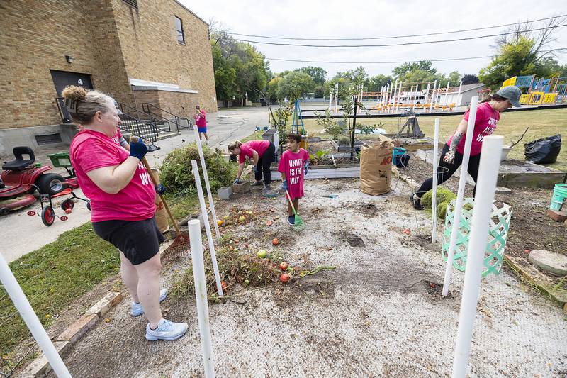 Between explorations of interesting bugs and insects, Kam Horton, 7, of Dixon helps clear up the garden Saturday, Sept. 13, 2025, during United Way of Lee County’s Day of Caring.
