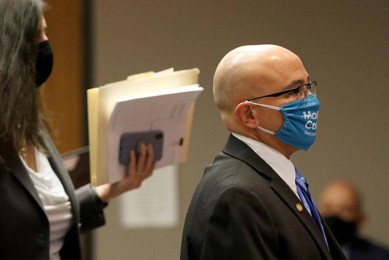 Former Illinois Department and Children of Family Services caseworker and current McHenry County Board member Carlos Acosta leaves Judge Robert Wilbrandt’s courtroom with his attorney, Rebecca Lee (left), on Thursday at the Michael J. Sullivan Judicial Center, formerly known as the McHenry County Courthouse, in Woodstock. Acosta was the caseworker assigned to the AJ Freund case.