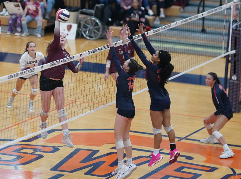 Lockport's Jenna Kolosta (18) goes up for a kill against Oswego during a class 4A Oswego Sectional semifinal match at Oswego High School on Monday, Oct. 30, 2023.