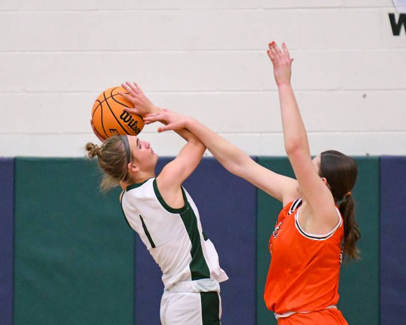 Glenbard West's Nina Hendricksen (1) goes up for a shot and gets fouled by St. Charles East's Caleigh Higgins (44) during the 4A Sectional championship game on Thursday Feb. 26, 2026, held at Bartlett High School.