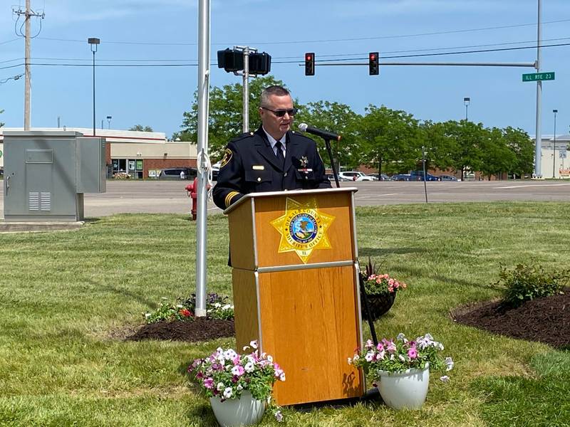 DeKalb County Sheriff Andy Sullivan gives remarks about his late Deputy Christina Musil at the new first responders memorial outside Isaac Executive Suites, 2675 Sycamore Road, DeKalb, during a dedication ceremony held Sunday, May 19, 2024. The memorial was unveiled at the close of National Police Week.