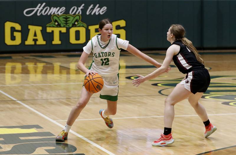 Crystal Lake South's Gaby Dzik brings the ball up the court against Prairie Ridge's Maia Cassin during a Fox Valley Conference girls basketball game on Friday, Dec. 13, 2024, at Crystal Lake South High School.