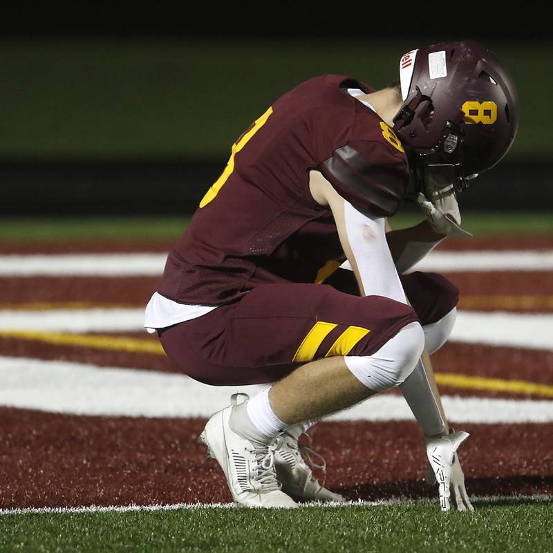 Richmond-Burton's Jack Martens battles his emotions as he walks off the field after Richmond-Burton lost to St. Viator in a IHSA Class 4A first round playoff football game Friday, Oct. 27, 2023, at Richmond-Burton High School in Richmond.