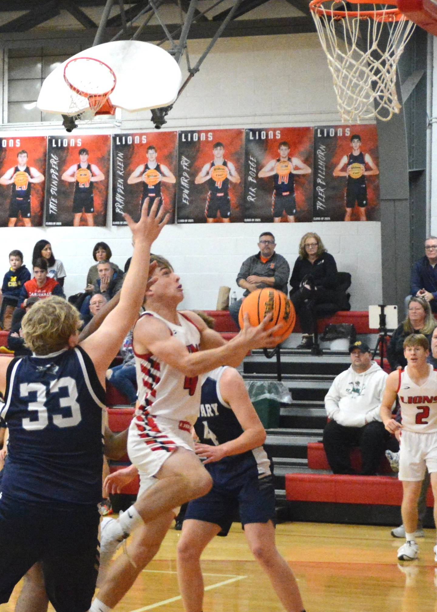 LaMoille's Ed Fry drives for a shot in Thursday's LaMoille Holiday Classic play against Calvary Christian. The Lions won 55-49.