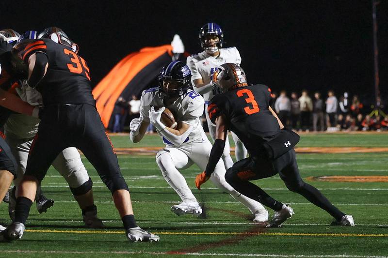Lincoln-Way East’s Brody Gish cuts to the inside on a run against Minooka on Friday, Nov. 8, 2024 in Minooka.