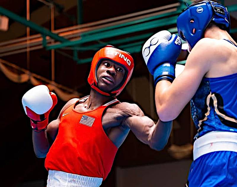 Joliet's JoJo Awinongya (left) lands a punch against Australia's Khaled Bassal in the 80 kg championship bout at the Brandenburg Cup in Germany. Awinongya won by abandonment in the third round.
