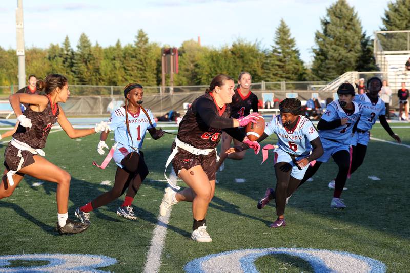 Yorkville's Kayla Kersting runs the ball as Kankakee defenders close in during the Foxes' 26-13 victory over Kankakee on Tuesday, Oct. 7, 2025.