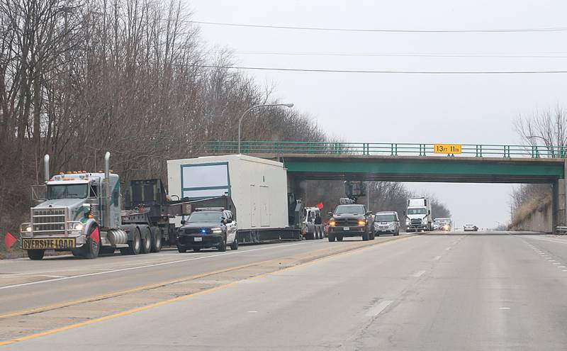 Illinois Department of Transportation workers inspect the 7th Street overpass on Tuesday, Dec. 20, 2022 in Peru. A large semi truck carrying an oversize load struck the bridge on Tuesday morning. IDOT and Peru Police were on the scene.