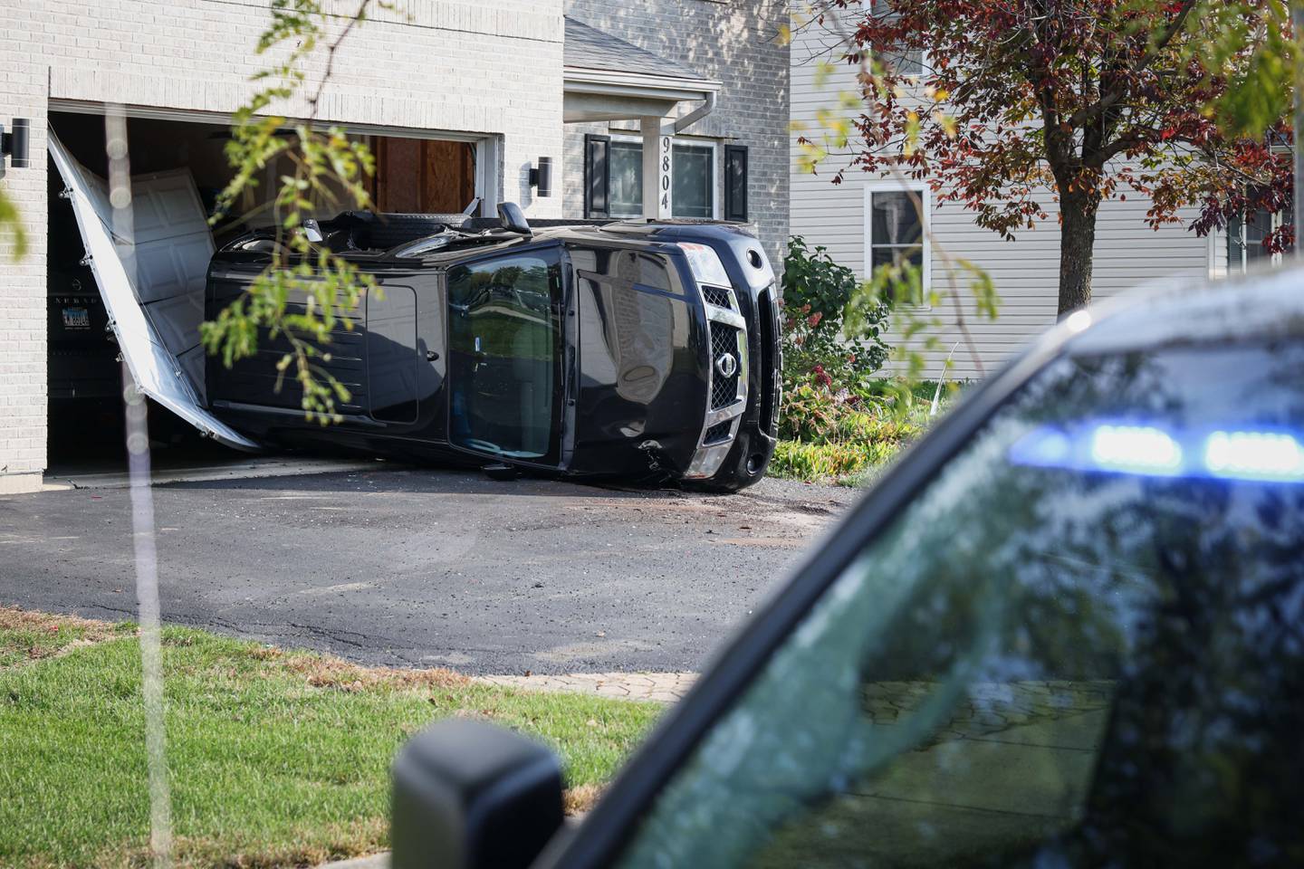 No injuries were reported Friday in a crash that occurred in the driveway of a Wonder Lake home that flipped the car parked there into the garage.