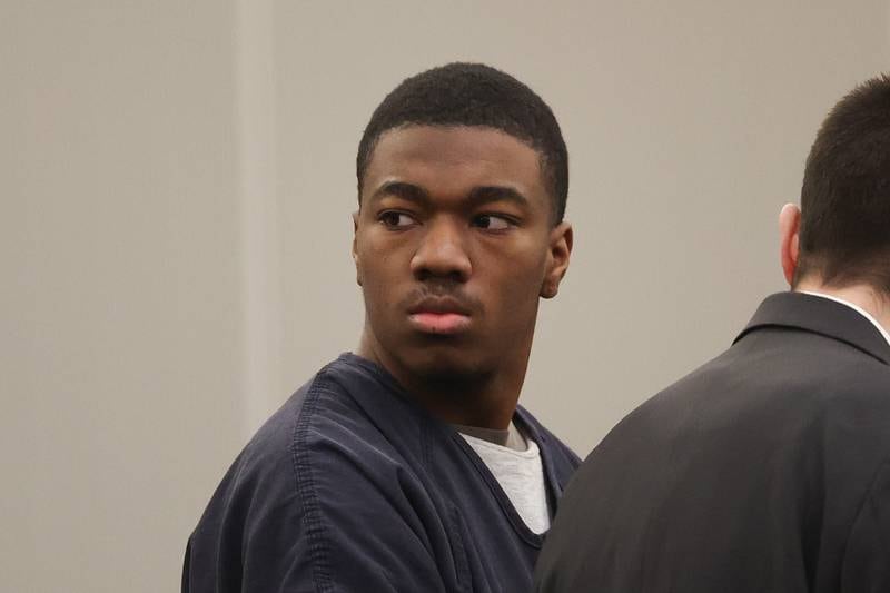 Byrion Montgomery, 17, of Bolingbrook, looks to his family and friends in the courtroom during his hearing at the Will County Courthouse on Thursday, March 30, 2023 in Joliet. Montgomery is accused of the murders of Cartez Daniels, 40, Samiya Shelton-Tillman, 17, and Sanai Daniels, 9, at a residence in the 100 block of Lee Lane in Bolingbrook, as well as attempted first-degree murder of Tania Stewart.