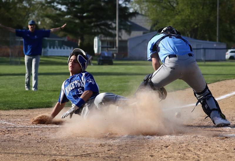 Princeton's Ace Christiansen beats the throw home to Bureau Valley catcher Sam Wright Thursday at Prather Field.