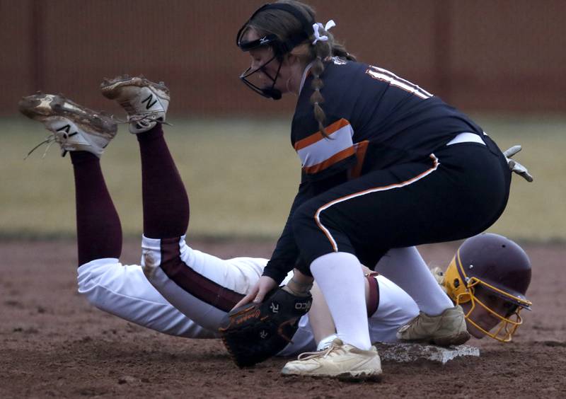 Richmond-Burton's Taylor Davison gets safely back to second base as McHenry’s Cooper Ten Bruin fields the throw during a non-conference softball game Tuesday March 22, 2022, between Richmond-Burton and McHenry at Richmond-Burton High School.