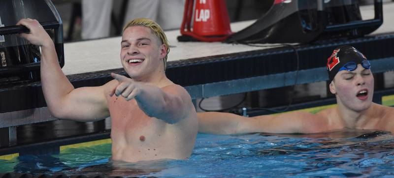 West Chicago’s Brady Johnson celebrates his victory in the 100-yard freestyle during the boys state swimming and diving finals at FMC Natatorium on Saturday, Feb. 24, 2024 in Westmont. Maine south's Dominick Mazurek, right, finished second.