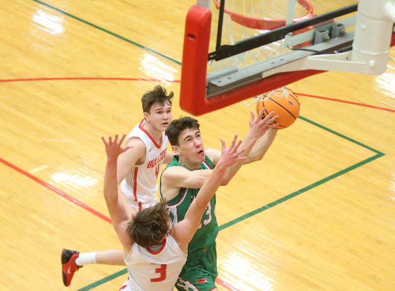 L-P's Nick Olivero drives in the lane as Streator's Nolan Ketcham and Blaize Bressner defend during the Class 3A Regional title game on Friday, Feb. 28, 2025 in Sellett Gymnasium at L-P High School.