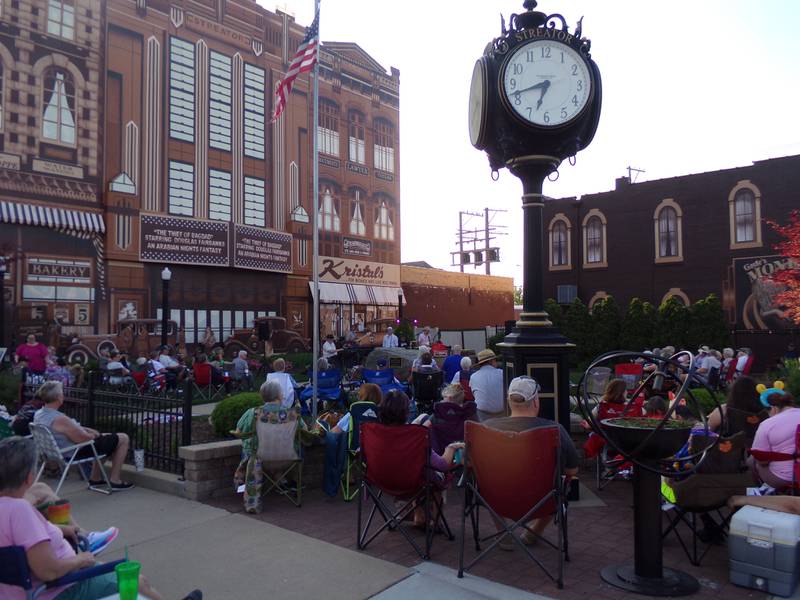 The Smokers Blues Band performs Friday, June 2, 2023, from behind the Kerr Clock at Heritage Park in Streator during the Jammin' at the Clock event.