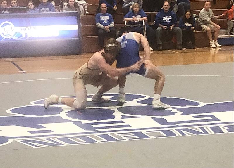 Tyler Semlar of Morris makes his move at 145 pounds against Princeton's Augie Christiansen Tuesday night at Prouty Gym.
