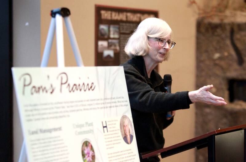 Pam Otto, a naturalist and outreach ambassador at the St. Charles Park District, speaks in front of friends and colleagues during a retirement party in her honor on Tuesday, Dec. 17, 2024 at the Hickory Knolls Discovery Center in St. Charles.