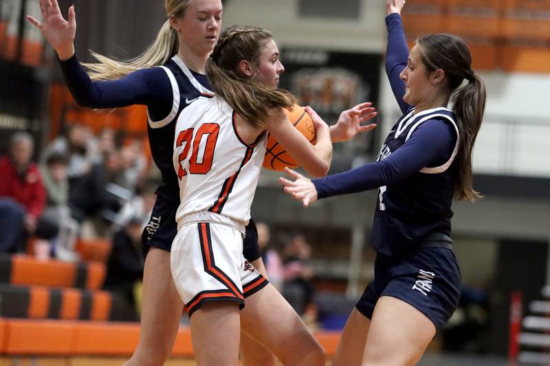 Cary-Grove’s Alivia Nelson, left, and Samantha Skerl, right, pressure Crystal Lake Central’s Hadley Ferrero in varsity girls basketball on Tuesday, Jan. 7, 2025, at Crystal Lake Central High School in Crystal Lake.