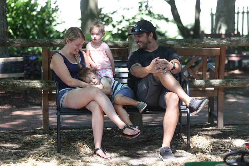 Jessica and Adam Caffle enjoy a quiet moment with their children Adaline, 2, and Grayson, 3, at the Children’s Garden in Elwood. The Children’s Garden in Elwood recently celebrated their 25th anniversary. Saturday, July 9, 2022 in Elwood.