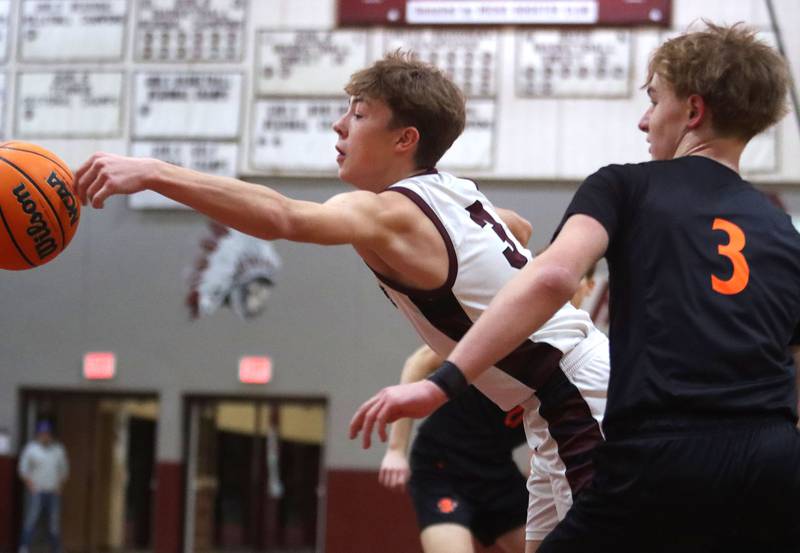 Marengo’s Caden Bezik, left, and Sandwich’s Wyatt Koley play for the ball in varsity boys basketball action on Saturday, Jan..24, 2025, at Marengo High School in Marengo.