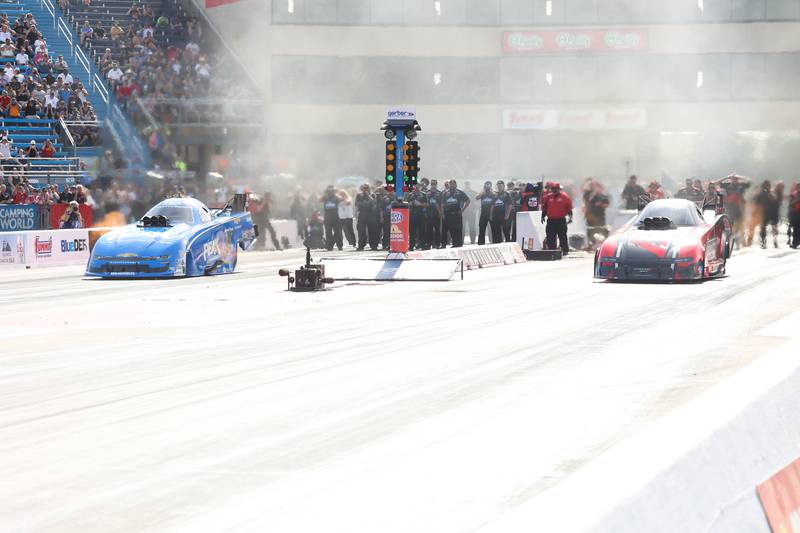 John Force, left, and Matt Hagan take off in the Funny Car championship race at the NHRA’s Gerber Collision and Glass Route 66 Nationals at Route 66 Raceway on Sunday, May 19, 2024 in Joliet.