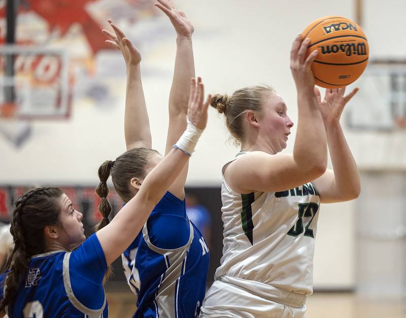River Ridge’s Sarah Winter makes a pass against Newman Thursday, Feb. 20, 2025, during the Class 1A girls basketball regional at Forreston.