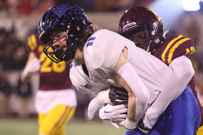 Lincoln-Way East’s Ryan Usher secures the ball after a catch against Loyola in the Class 8A championship on Saturday, Nov. 25, 2023 at Hancock Stadium in Normal.