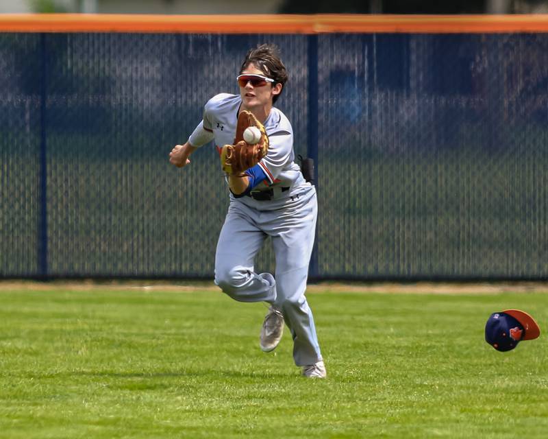 Oswego's Andrew Hart (10) makes a catch in the outfield during the Class 4A Romeoville Sectional final game between Plainfield North at Oswego.  June 4, 2022.