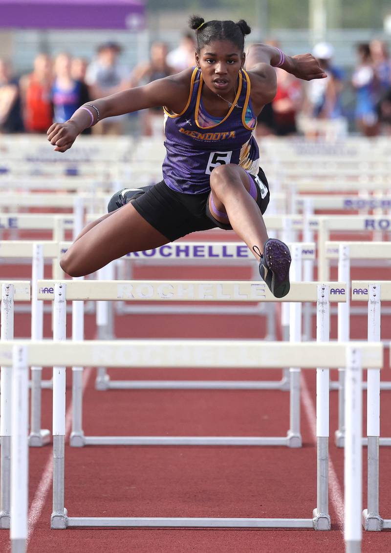 Mendota’s Mariyah Elam (center) competes in the 100 meter hurdles Wednesday, May 8, 2024, during the girls track Class 2A sectional at Rochelle High School. Hernandez qualified for state.