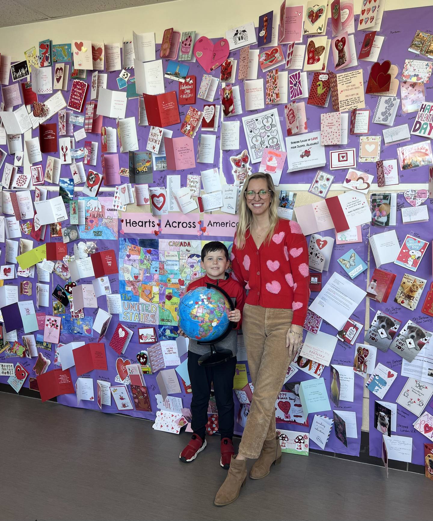 Carli Cade's second grade class at Jefferson Elementary School in Ottawa received Valentines from all 50 states and 22 other countries. Hayden Bressendorf, pictured with Cade, received 15 Valentines.