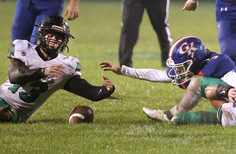 Rock Falls' Richard Nichols recovers a fumble as Genoa-Kingston's Austin Braffet reaches for it during their game Friday, Oct. 13, 2023, at Genoa-Kingston High School.