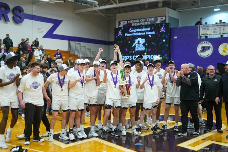 Kaneland players celebrate their victory over Plano to win the 60th annual Plano Christmas Classic Basketball Tournament at Plano High School on Saturday, Dec 30, 2023.
