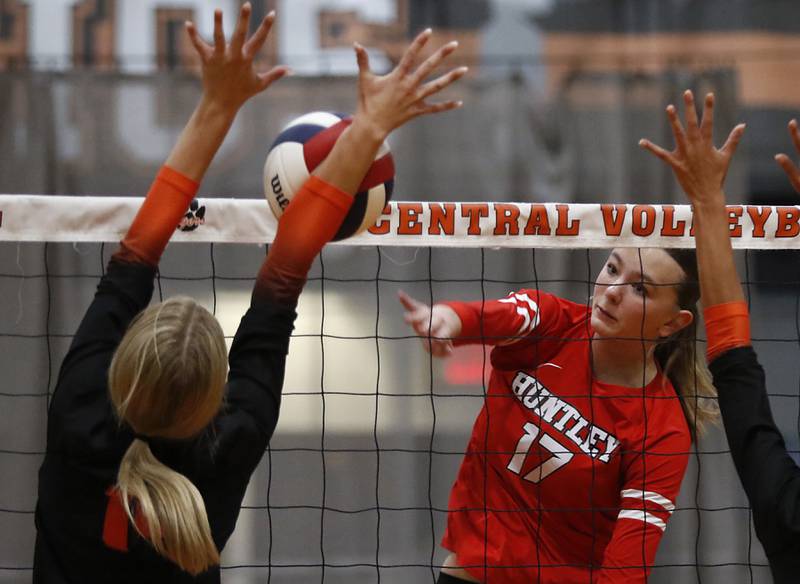 Huntley’s Lucy Watson (right) hirs the ball towards the black attemptt of Crystal Lake Central's Alexis Hadeler during a Fox Valley Conference volleyball match on Tuesday,Aug. 26, 2025, at Crystal Lake Central High School.
