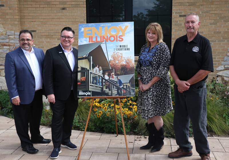 Bob Navarro, President and CEO of Heritage Corridor Destinations; Daniel Thomas, Illinois Travel Director and Jennifer and Tim Bias owners of Camp Aramoni, are presented with the cover of the fall winter 2023-2024 Enjoy Illinois magazine on Monday, Sept. 18, 2023 at Camp Aramoni.