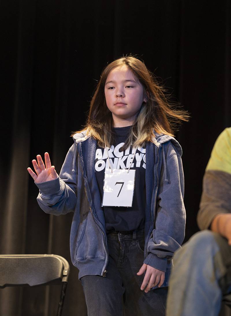 Ava Christianson of Lincoln Elementary School comes on stage Thursday, Feb. 19, 2026, during the Lee-Ogle-Whiteside County Regional Spelling Bee. Christianson missed in round 6 on the word achromatic.