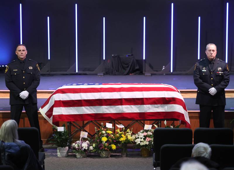 DeKalb County sheriff's deputies stand on either side of the casket of former DeKalb County Sheriff Roger Scott during his visitation Thursday, March 6, 2025, at Bethany Road Bible Church in DeKalb. Scott, who was the county sheriff for more than 30 years, died on February 23 at the age of 78.