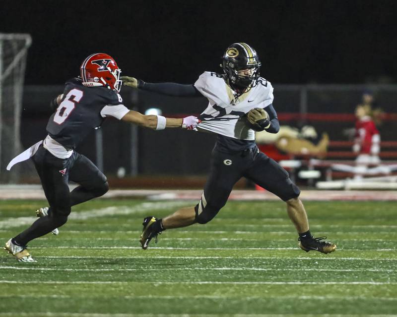 Yorkville's Hunter Niklos (6) runs down Glenbard North's Donato Gatses (22) during Class 7A first round football game between Glenbard North at Yorkville. Friday, Oct 31, 2025 in Yorkville.
