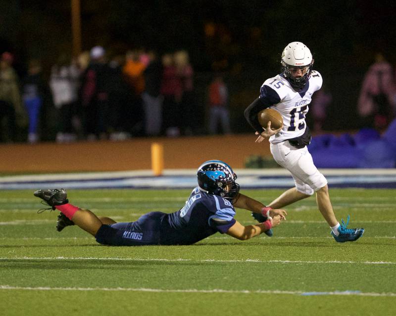 Downers Grove South's Jonathan Cinco goes for the tackle on Addison Trails Nico Dill on Friday, Oct.20,2023 in Downers Grove.