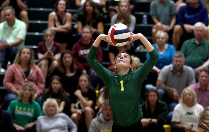 Crystal Lake South’s Olivia Apt sets the ball against Prairie Ridge in varsity volleyball at Crystal Lake South Tuesday night.