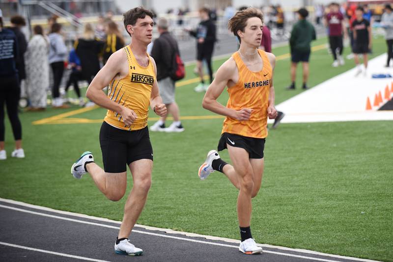 Herscher's Brayden Shepard, left and Jackson Kruse lead the pack during the 3,200 m run at the Herscher Invite Friday, May 2, 2025.