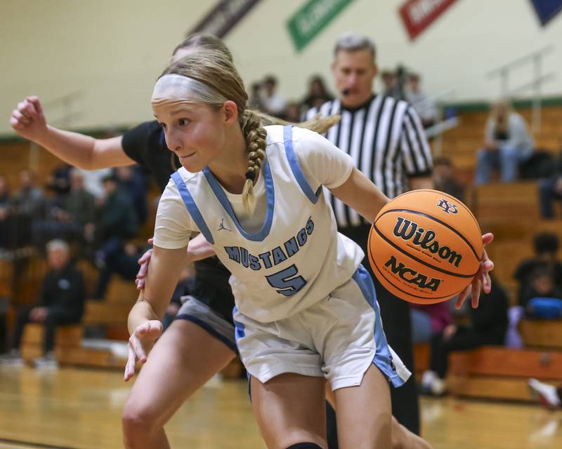 Downers Grove South's Molly Mihalik (5) drives baseline during their York Thanksgiving Tournament matchup between Oswego East at Downers Grove South Friday, Nov 20, 2025 in Elmhurst.