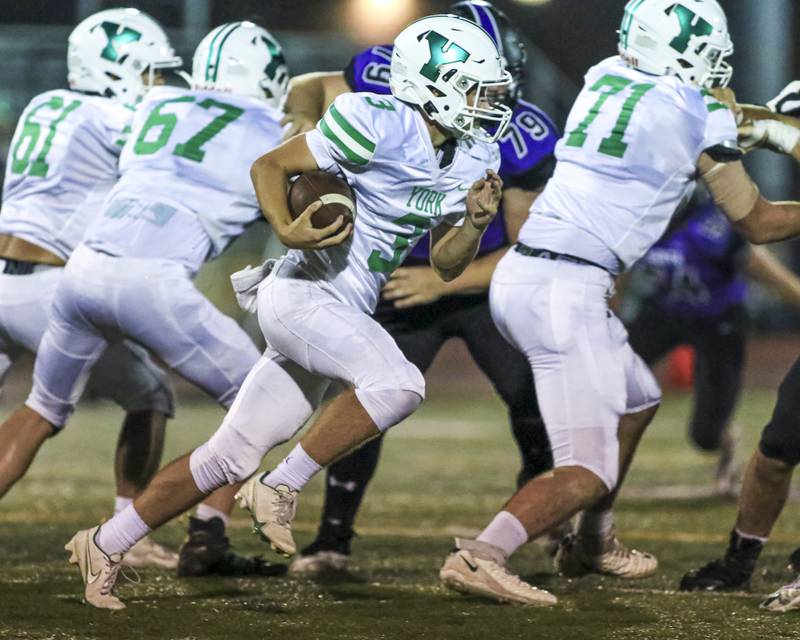 York's Colin Doherty (3) runs behind the line during football game between York at Downers Grove North.  Sept 17, 2021.