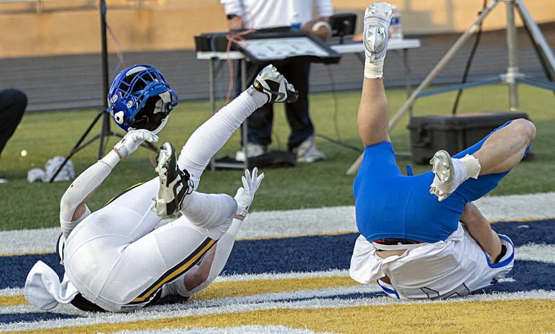 St. Francis’ Zachary Washington loses his helmet after making a TD catch against Sterling’s Cale Ledergerber Saturday, Nov. 4, 2023 in a class 5A playoff game in Sterling.
