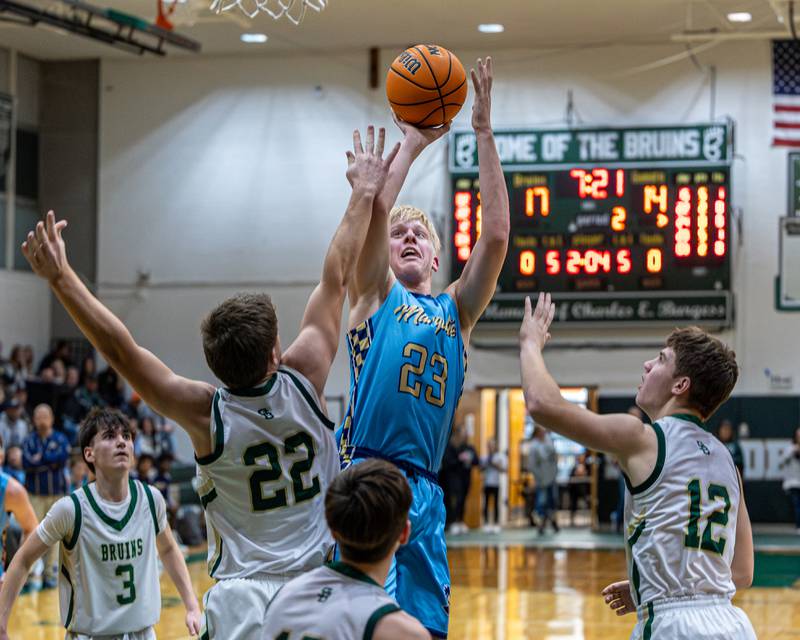 Luke McCullough (23) of Marquette shoots basketball over Aj Hermes (22) of St. Bede on Friday, January 16, 2026 at St. Bede Academy in Peru.
