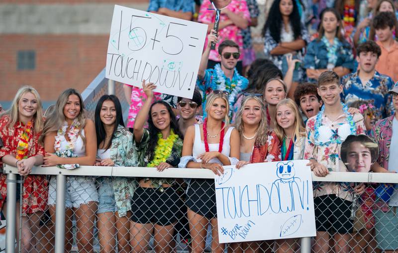 Lake Zurich fans hold up signs in support of their team against St. Charles North during a football game at St. Charles North High School on Friday, Sep 2, 2022.