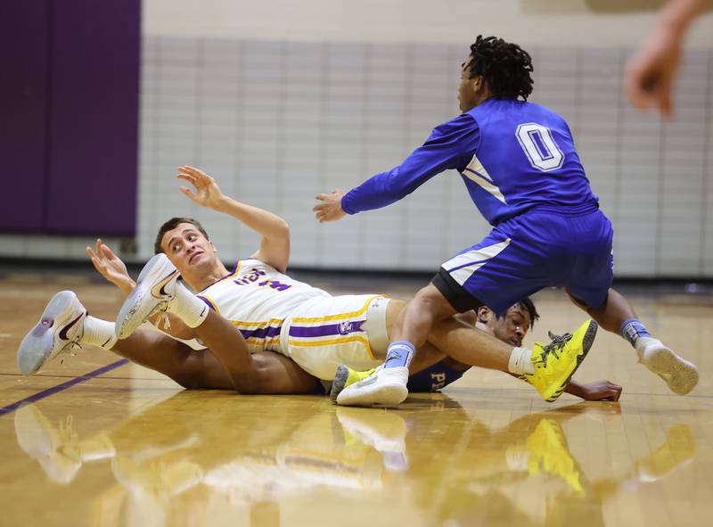 Players pile up during the boys 4A varsity regional final between Downers Grove North and Proviso East in Downers Groves on Friday, Feb. 24, 2023.