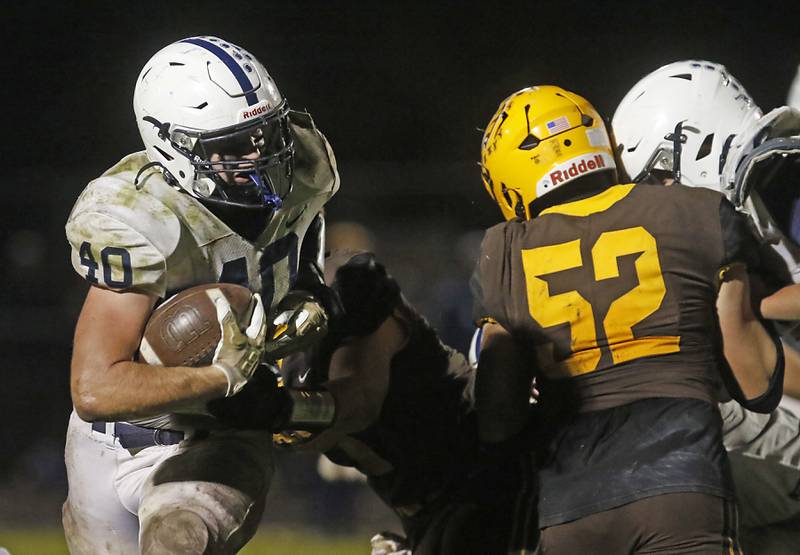 Cary-Grove's Logan Abrams powers through the Jacobs’ defense during a Fox Valley Conference football game on Friday, Oct. 24, 2025, at Jacobs High School in Algonquin.