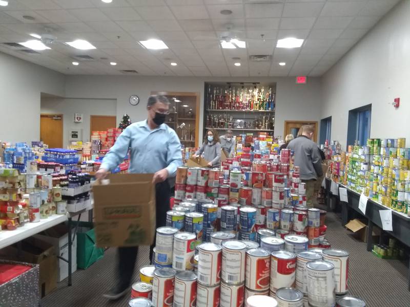 Employees of the Meadowvale Corp. packed Franklin Mall grocery boxes for distribution throughout the community in 2021.