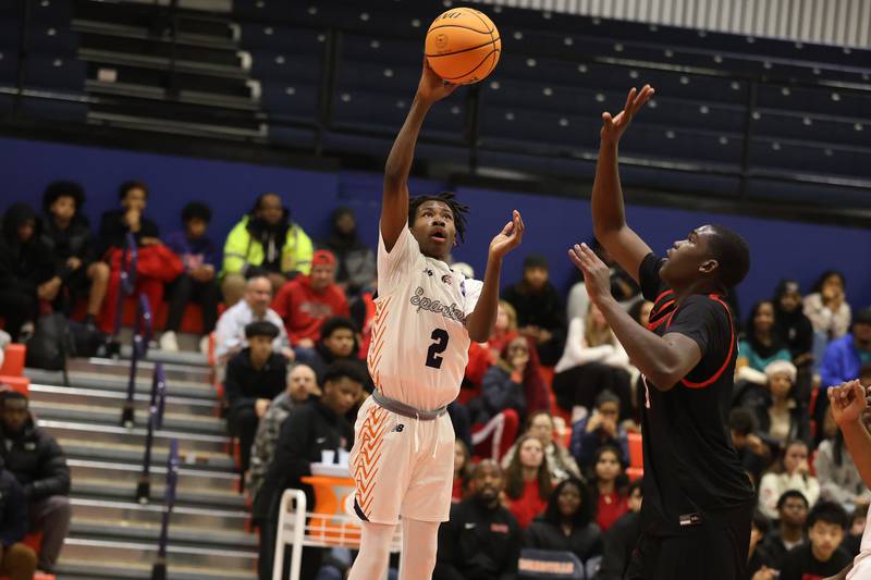 Romeoville's Deon Grant floats a shot against Bolingbrook on Tuesday, Dec. 2, 2025 in Romeoville.