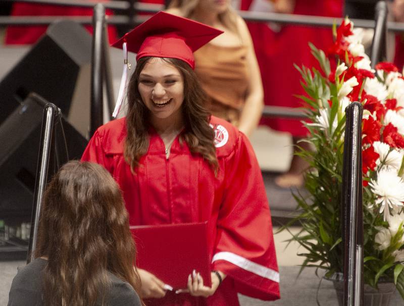 Graduate Lylah Raquel Colin is all smiles after receiving her diploma during Yorkville High School's class of 2022 graduation ceremony at the NIU Convocation Center on Friday, May 20, 2022.